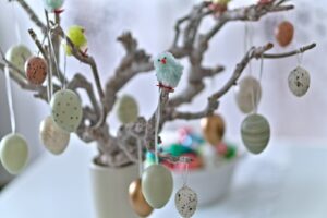 Easter eggs decorate a festive, decorative branch.